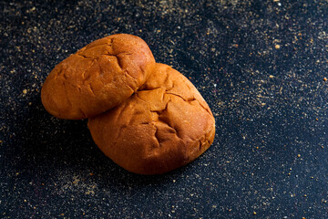 soft bread or bun over dark background