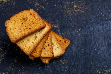 crispy rusk, cake rusk over Dark background