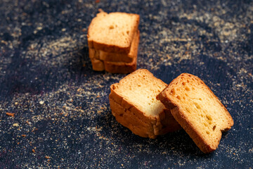 crispy rusk, cake rusk over Dark background