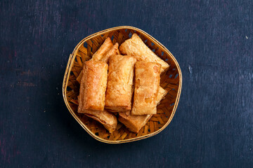 indian khari or kharee or salty Puff Pastry Snacks in wooden bowl