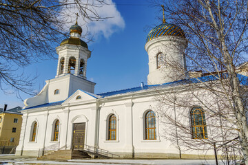 The restored Vvedenskaya church on the banks of the Urals in winter. The picture was taken in Russia, in the city of Orenburg