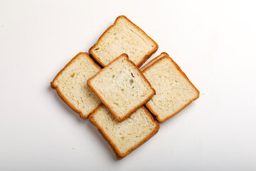 Cut of loaf bread on white against white background