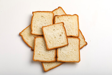 Cut of loaf bread on white against white background
