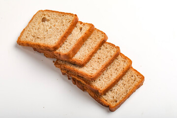 Cut of loaf bread on white against white background