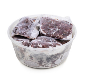 Homemade minced barf raw food for dogs packaged and frozen in serving size for preservation.