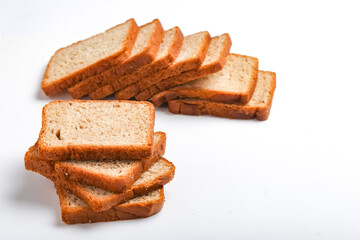 Cut of loaf bread on white against white background