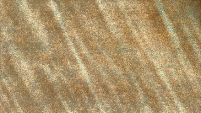 Old yellowed sackcloth under slanting sun rays. Rough canvas texture