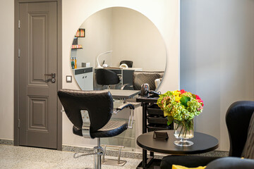 Interior of empty modern hair and beauty salon in lights tones