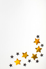 Festive Flatlay y of black and gold stars. Copy space.