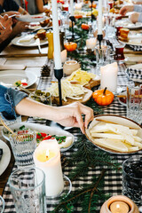 a woman is taking cheese plate at breakfast table. concept breakfast table.  Homemade Traditional Turkish Breakfast 