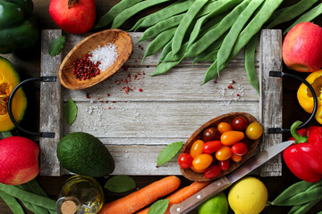 Food background. Vegetables and fruits on wooden background. Top view with copy space.