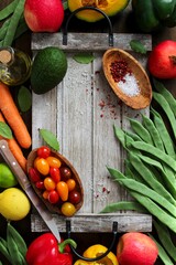 Food background. Vegetables and fruits on wooden background. Top view with copy space.