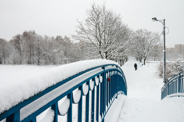 Snowstorm on the bridge, snow flying through the railing. Snow storm, snowstorm in the city. Huge...