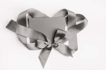 monochrome letter with ribbon bow to Valentine's Day