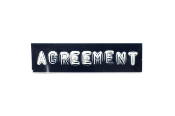 Embossed letter in word agreement on black banner with white background