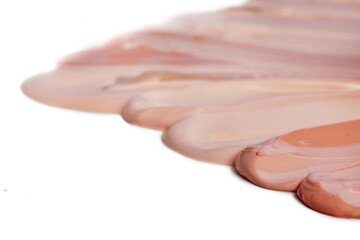 Collection of make up liquid foundation strokes isolated on a white background. 