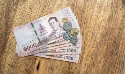 Thai baht, bills and coins on the table