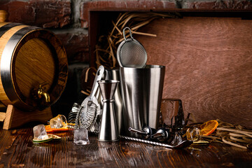 Bartender and barman tools for making cocktails and drinks bar counter black background copyspace