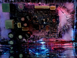 creative photo of an electrical circuit in ice glowing like city lights at night