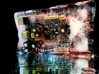 electrical board frozen in ice like a city shining with night lights