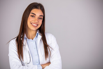 Portrait of beautiful female doctor looking at camera.Beautiful female doctor. Woman doctor dressed white medical uniform isolated studio portrait.