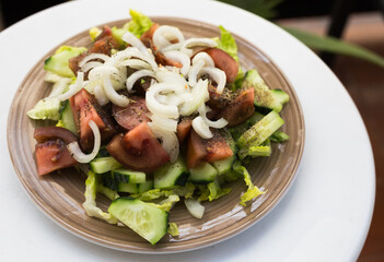vegetarian healthy vegetable salad on brown plate