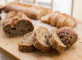fresh loaf of bread on wooden board