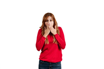 Beautiful young woman dressed in a red sweater, surprised with her hands in her mouth, isolated on a white background.