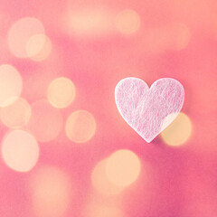 Valentine's Day background with bokeh. Pink heart over red. Valentines day concept. Flat lay, top view, copy space
