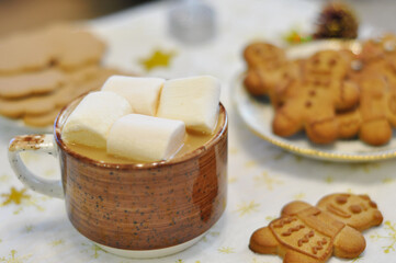 cup of hot chocolate with marshmallow with gingerbread cookies