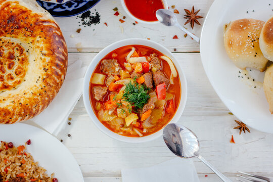 Top view of lagman or laghman uygur dish on white table.