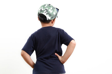 Rearview of a Stylish cute little Asian boy wearing cap and sunglasses posing on white background