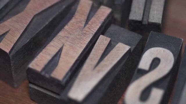 detailed background of vintage wooden letterpress, diagonal right to left camera tracking 