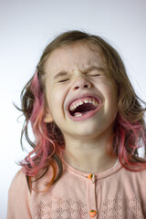Adorable little kid girl laughing on white