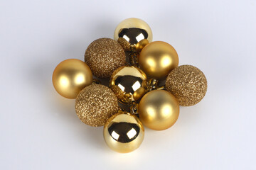 Pyramid from a golden christmas balls close up view selective focus