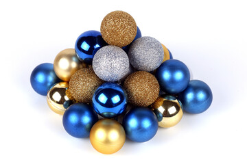 Pyramid from a blue, gold and silver christmas balls close up view selective focus