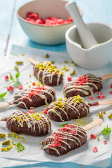 Sweet Popsicles made of white and dark chocolate