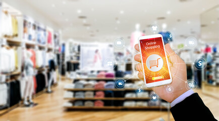 Mock up image of woman hand holding and using mobile smart phone with blank white scree in shopping...