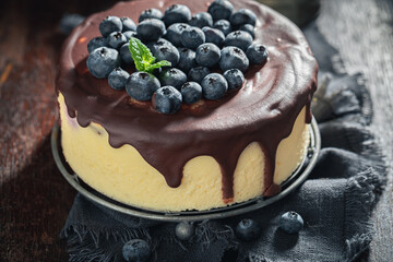 Delicious blueberry cheesecake made of fresh fruits and chocolate glaze