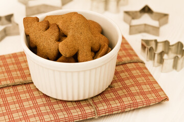 Christmas gingerbread cookies in a white bowl