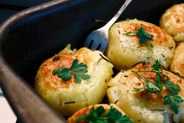 Baked potato  with garlic and herbs