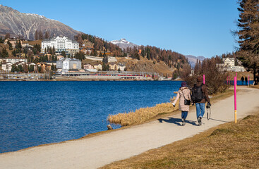 Walkers on the promenade by Lake St. Moritz