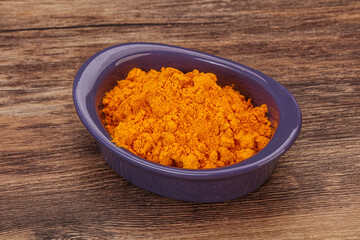Tumeric powder in the bowl