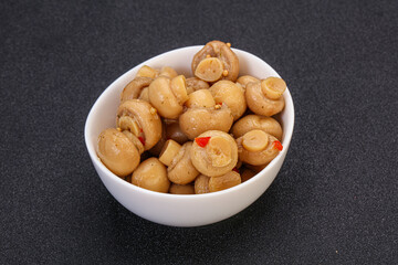 Pickled champignons in the bowl