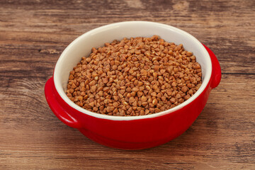Raw buсkwheat cereal in the bowl