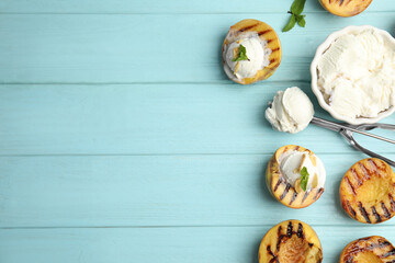 Delicious grilled peaches with ice cream and mint on light blue wooden table, flat lay. Space for text