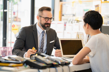 staff at shop automobile,happy service. office store professional maintenance. 