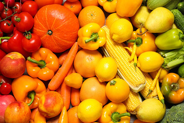 Assortment of organic fresh fruits and vegetables as background, closeup