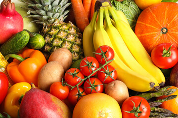 Assortment of fresh organic fruits and vegetables as background, closeup
