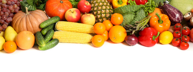Assortment of fresh organic fruits and vegetables on white background